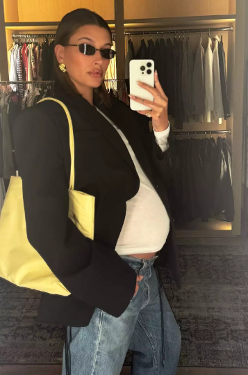 Hailey Bieber Flaunts Growing Baby Bump in White T-Shirt & Jeans